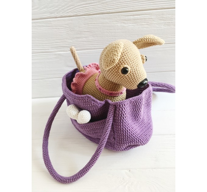 Stuffed Chihuahua dog in a bag