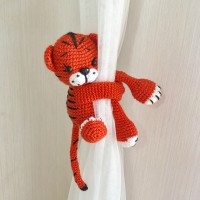 Tiger curtain tieback