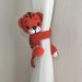 Tiger curtain tieback
