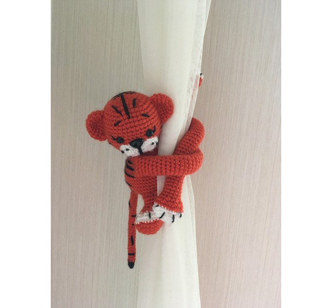 Tiger curtain tieback