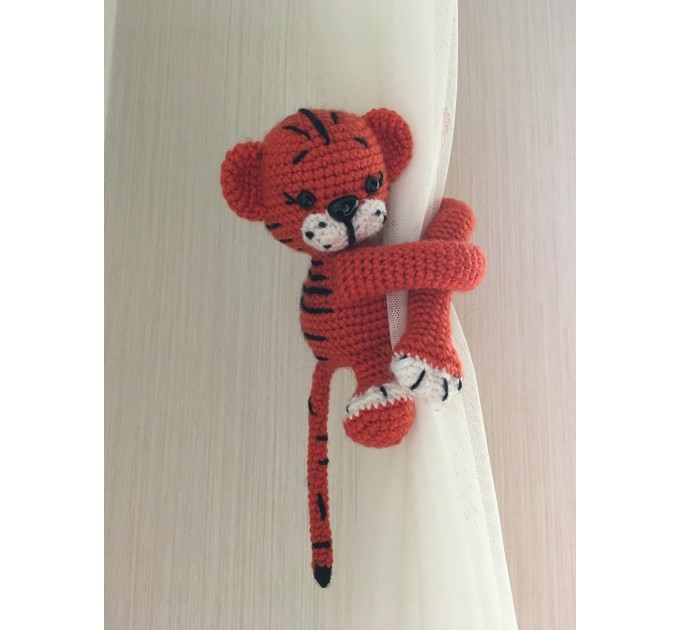 Tiger curtain tieback