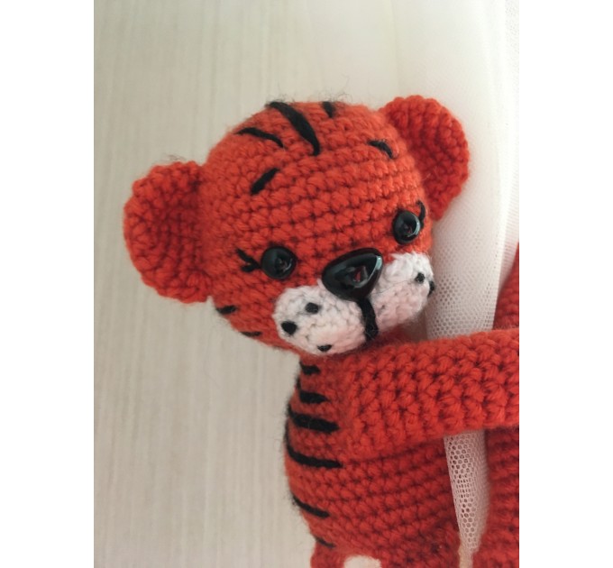 Tiger curtain tieback