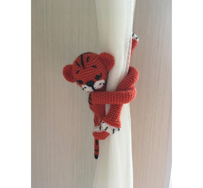 Tiger curtain tieback