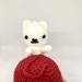 white plush cat on ball