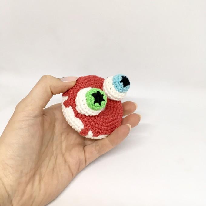 red donut with eyes