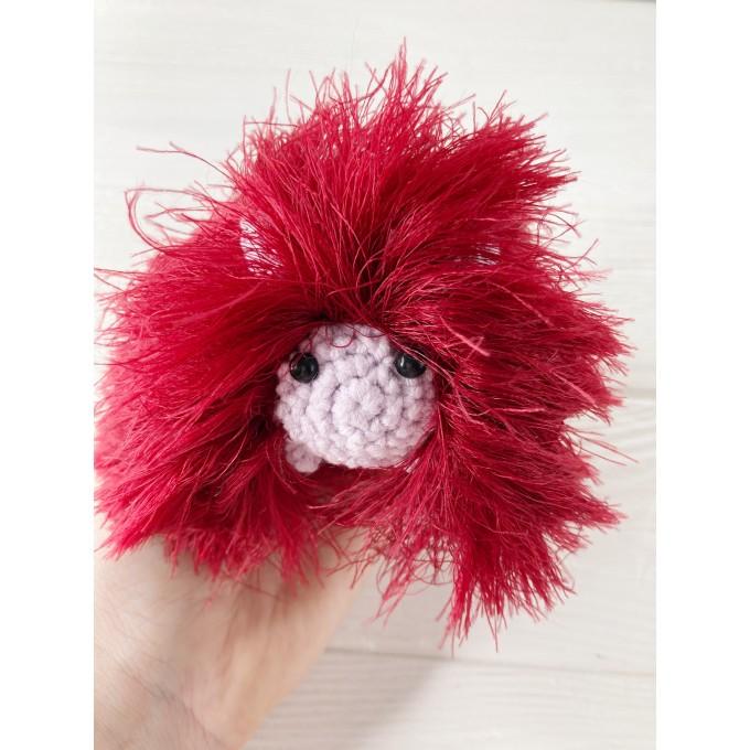 red and pink furry caterpillar
