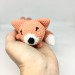 plush sleeping fox on hand